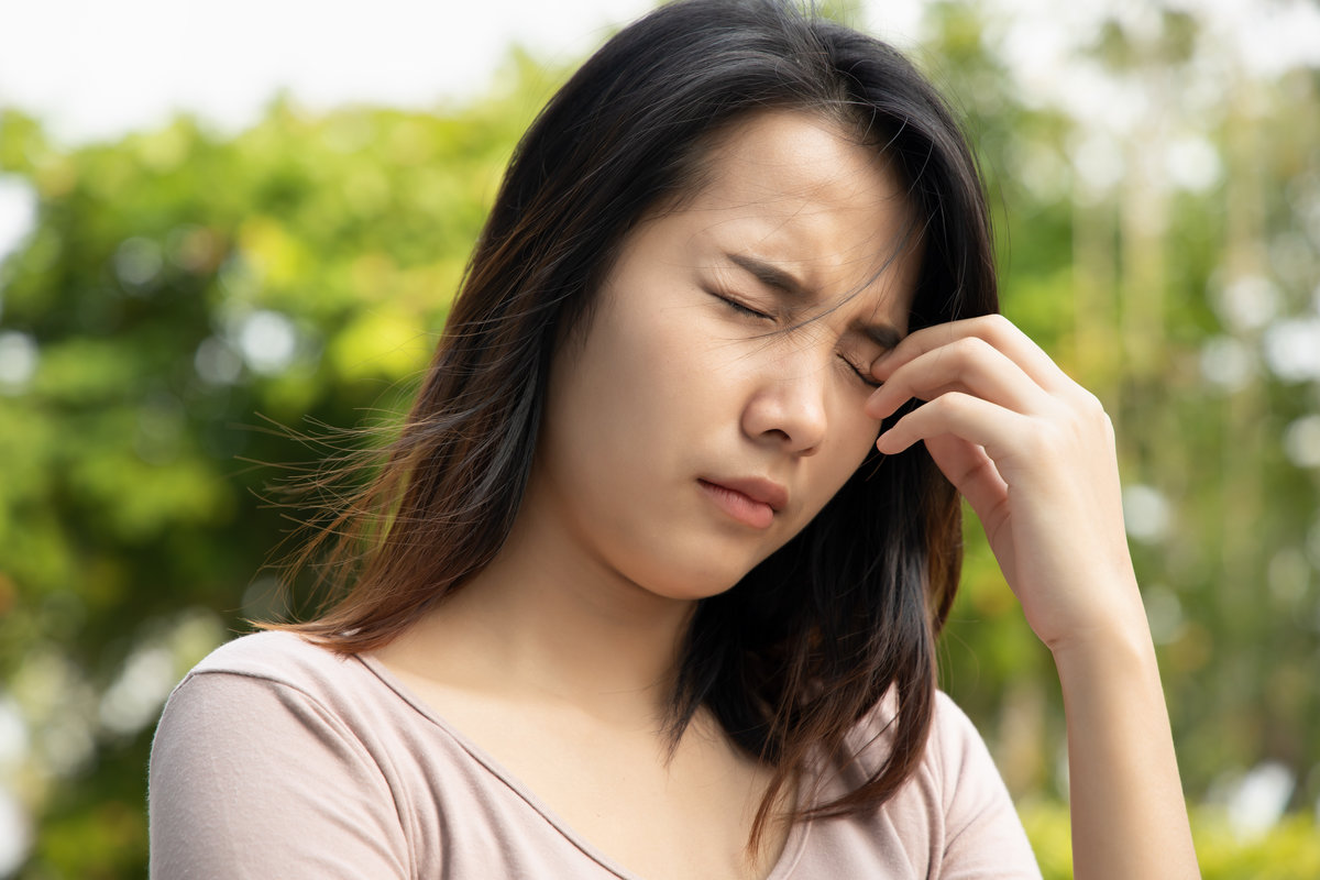 asian woman suffering from irritated eye; concept of optical health care, red eye allergy, eye care, allergic or itching or dry eye inflammation; young adult asian woman model