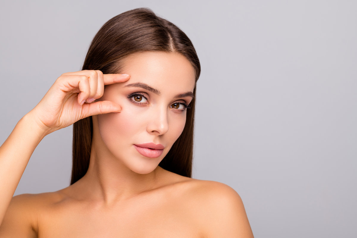 Closeup photo of beautiful lady nude naked shoulders plump shape, lips tempting appearance fingers check eyebrow eye line no wrinkles face isolated grey color background