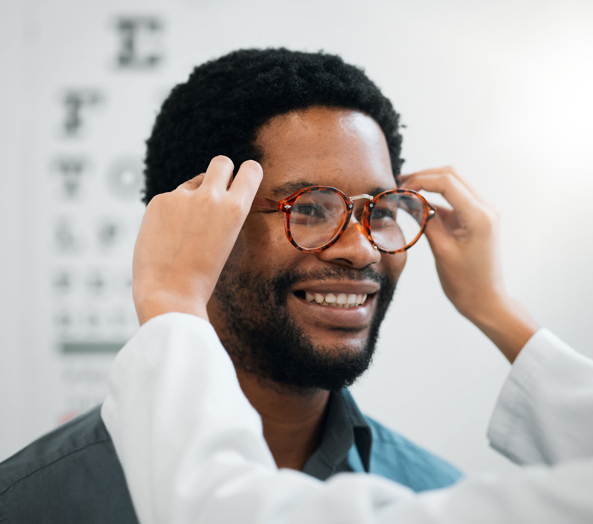 Black man, glasses and hands, vision and eye care, test and optometry with health and smile. Prescription lens, frame choice and healthcare, eyewear and optometrist with wellness and medical service.