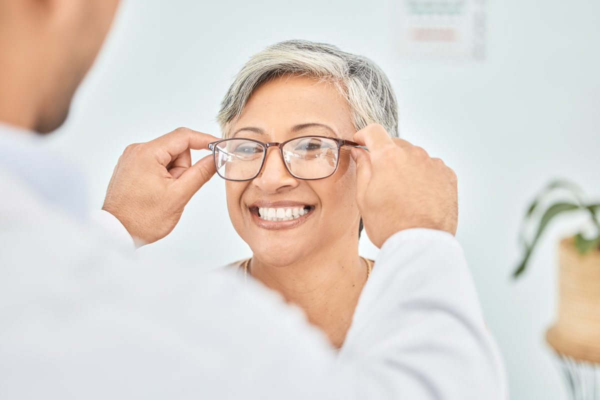 Eye care, glasses and senior patient with doctor, optometry and frame choice with help and people at clinic. Wellness, health and prescription lens, woman and optometrist with trust and eyewear.
